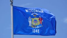 Wisconsin state flag in the sky