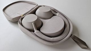 The Sony WH-1000XM5 wireless headphones in their carry case