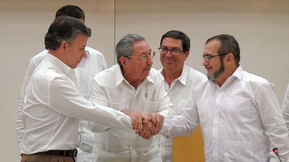 President Santos shakes hands with Farc leader Timonchenko