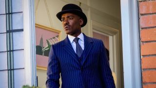 Ncuti Gatwa's Fifteenth Doctor dressed in blue pinstripe suit and wearing a bowler hat