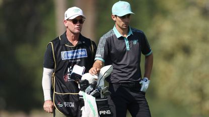 Who is Joaquin Niemann's Caddie? Joaquin Niemann standing with caddie Gary Matthews