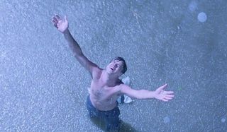 The Shawshank Redemption Andy stands in the rain, a free man