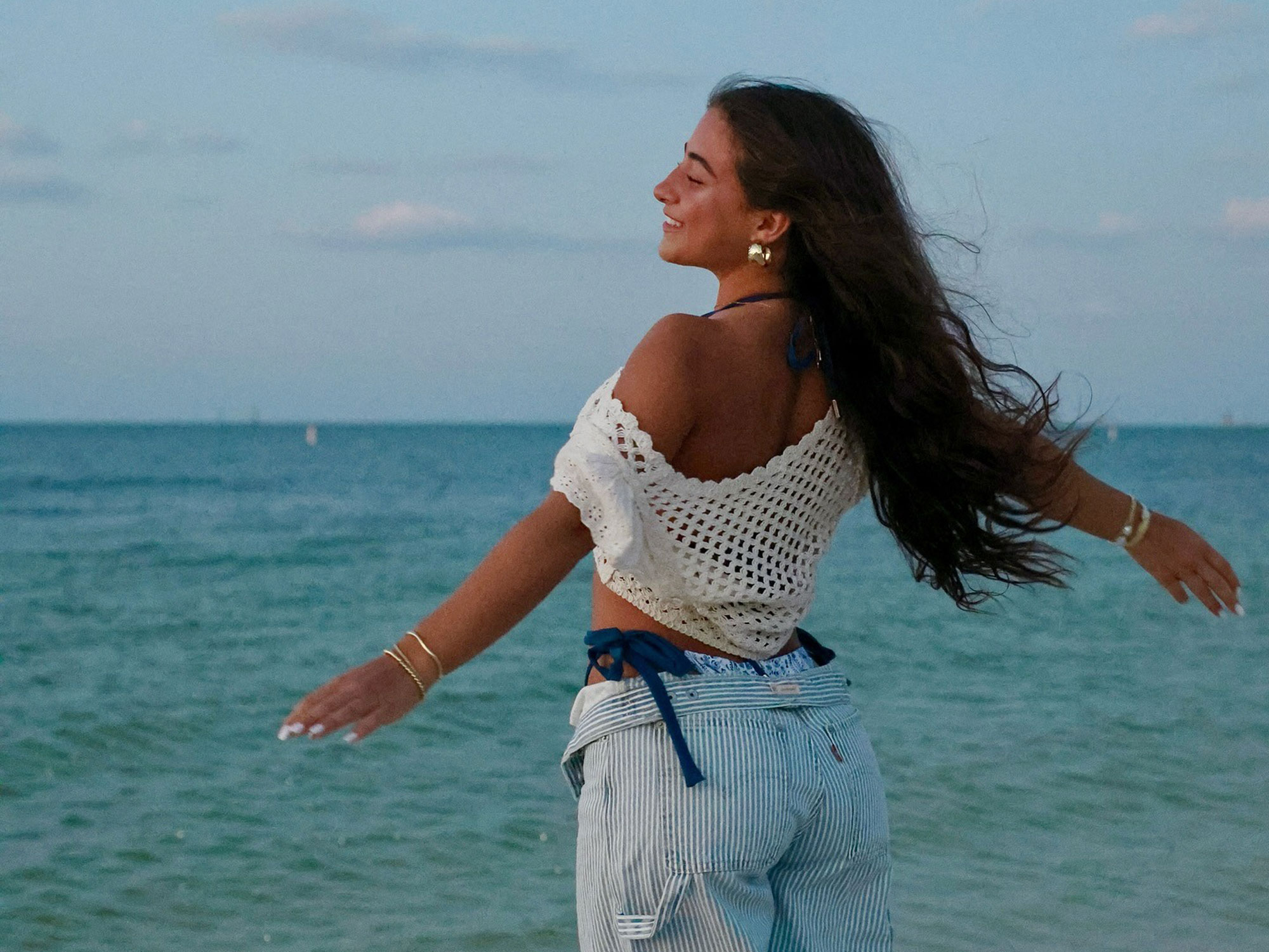Demetra Dias wears a crochet top.