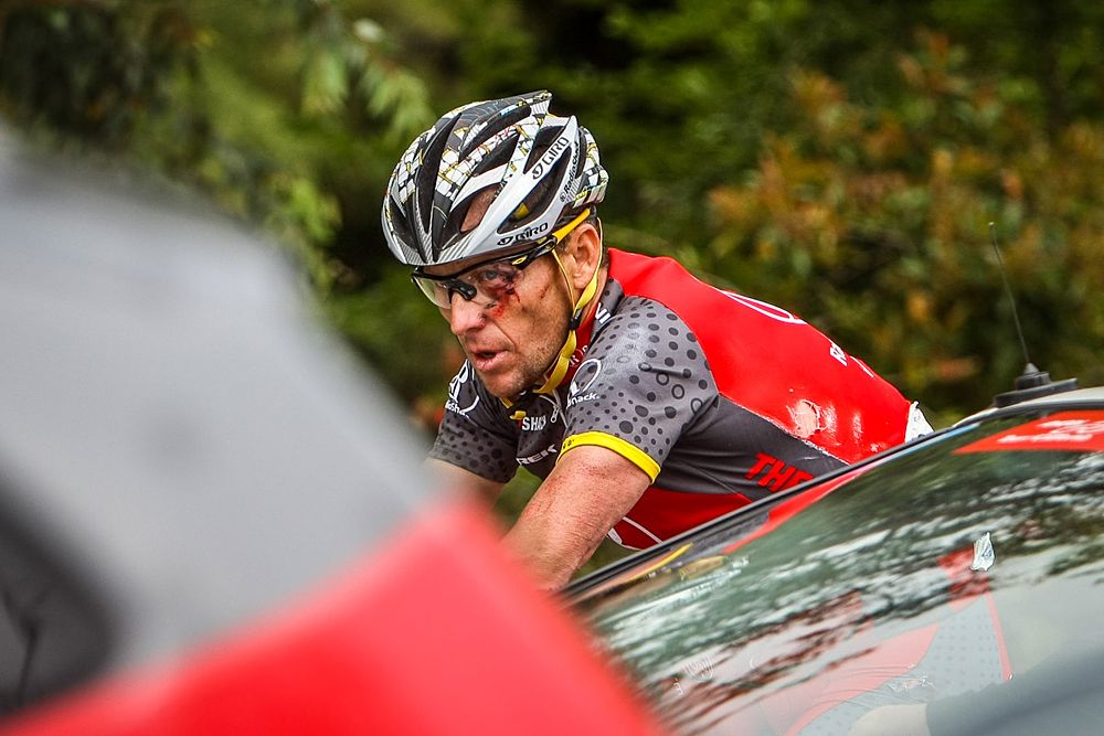 Lance Armstrong (RadioShack) looks dazed and bloodied after hitting the deck during the 2010 Tour of California