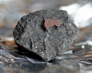 A chunk of the meteorite that was recovered from Winchcombe in England on March 1, 2021 — the first meteorite found in the United Kingdom since 1991.