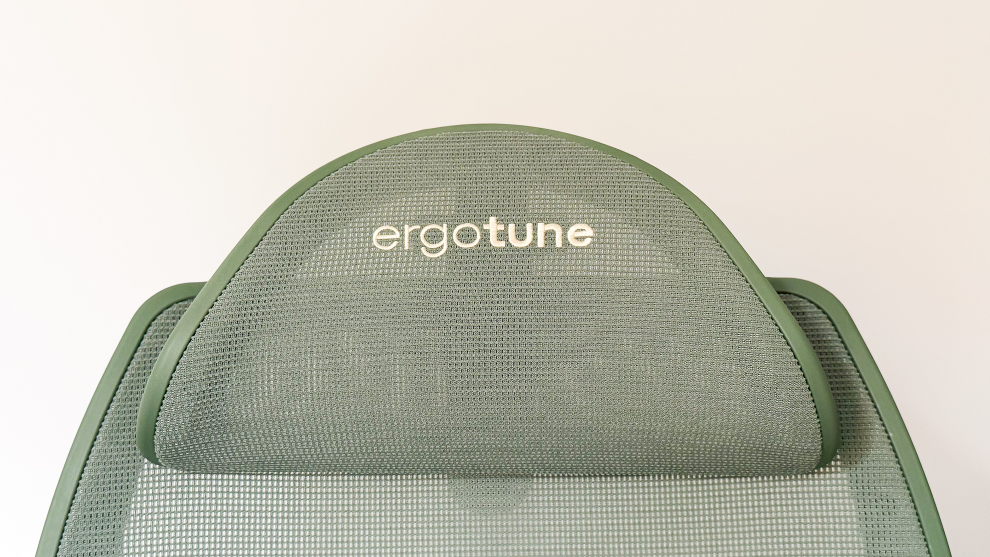Embroidered branding on the headrest of the ErgoTune Vesby office chair