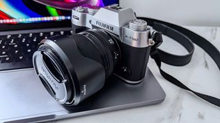 Fujifilm X-T50 kit sitting on a laptop keyboard