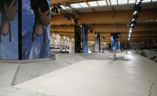 catwalk inside a Paris skate park for Kenzo's runway show featured oversized digital screens