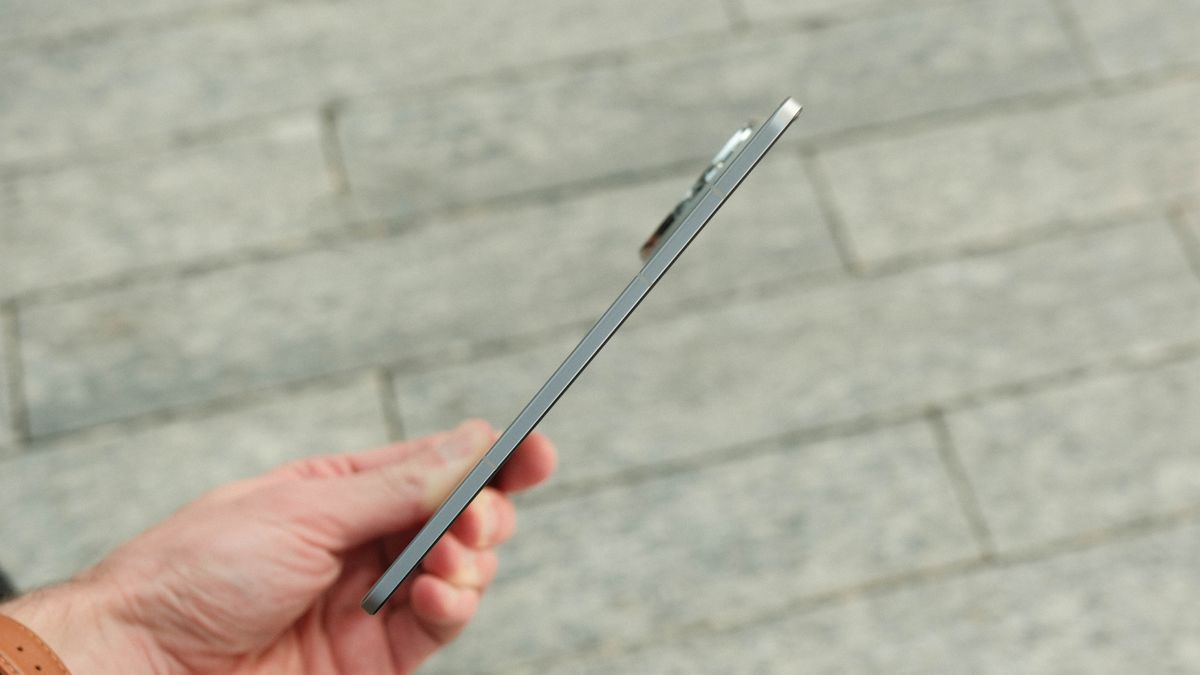 An extremely thin side-profile view of the phone in its fully unfolded state, emphasizing the impressively slim engineering of the hardware.