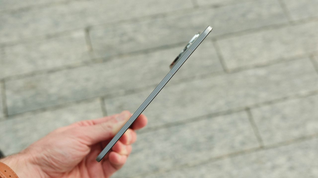 An extremely thin side-profile view of the phone in its fully unfolded state, emphasizing the impressively slim engineering of the hardware.