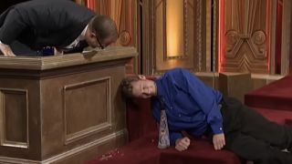 Drew Carey checks on Ryan Stiles after breaking glass with head on Whose Line Is It Anyway?