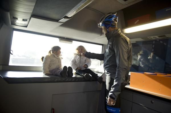 Christian Vande Velde shows his two daughters around the team bus