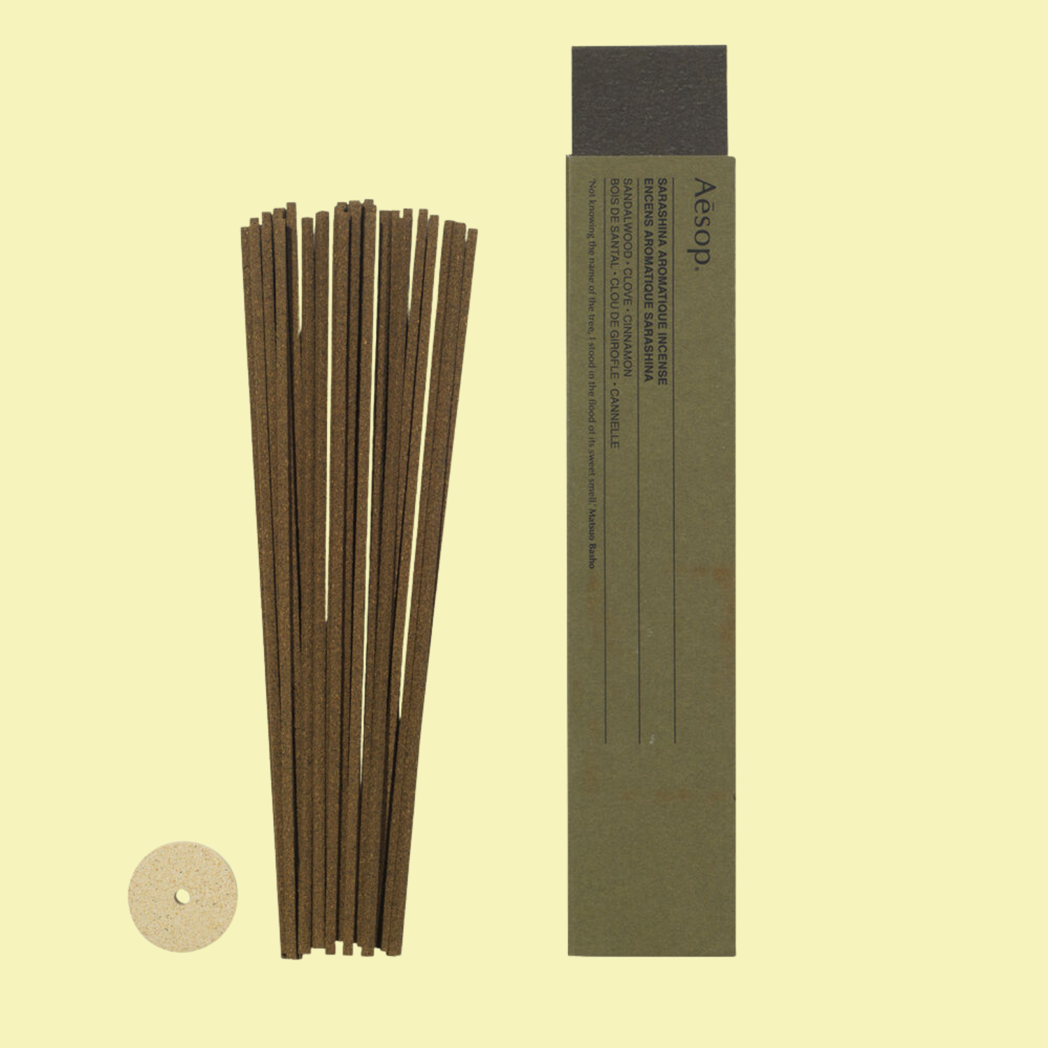 A pack of incense sticks alongside a pumice holder