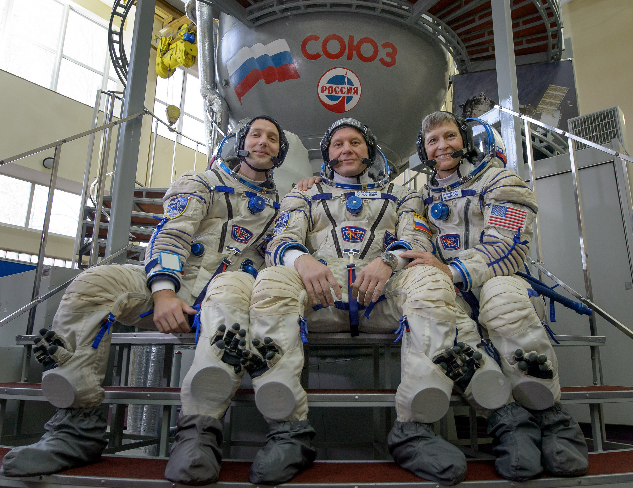 Astronauts Thomas Pesquet of ESA (European Space Agency), Oleg Novitskiy of the Russian space agency Roscosmos, and Peggy Whitson of NASA pose for a group photo at the Gagarin Cosmonaut Training Center in Star City, Russia during qualification exams for t