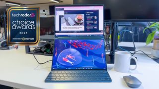 Lenovo Yoga Book 9i on a desk with a sign saying TechRadar Choice Awards