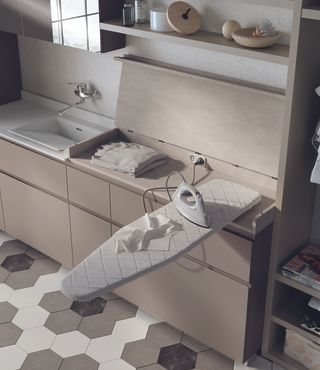 utility room design with foldaway ironing board