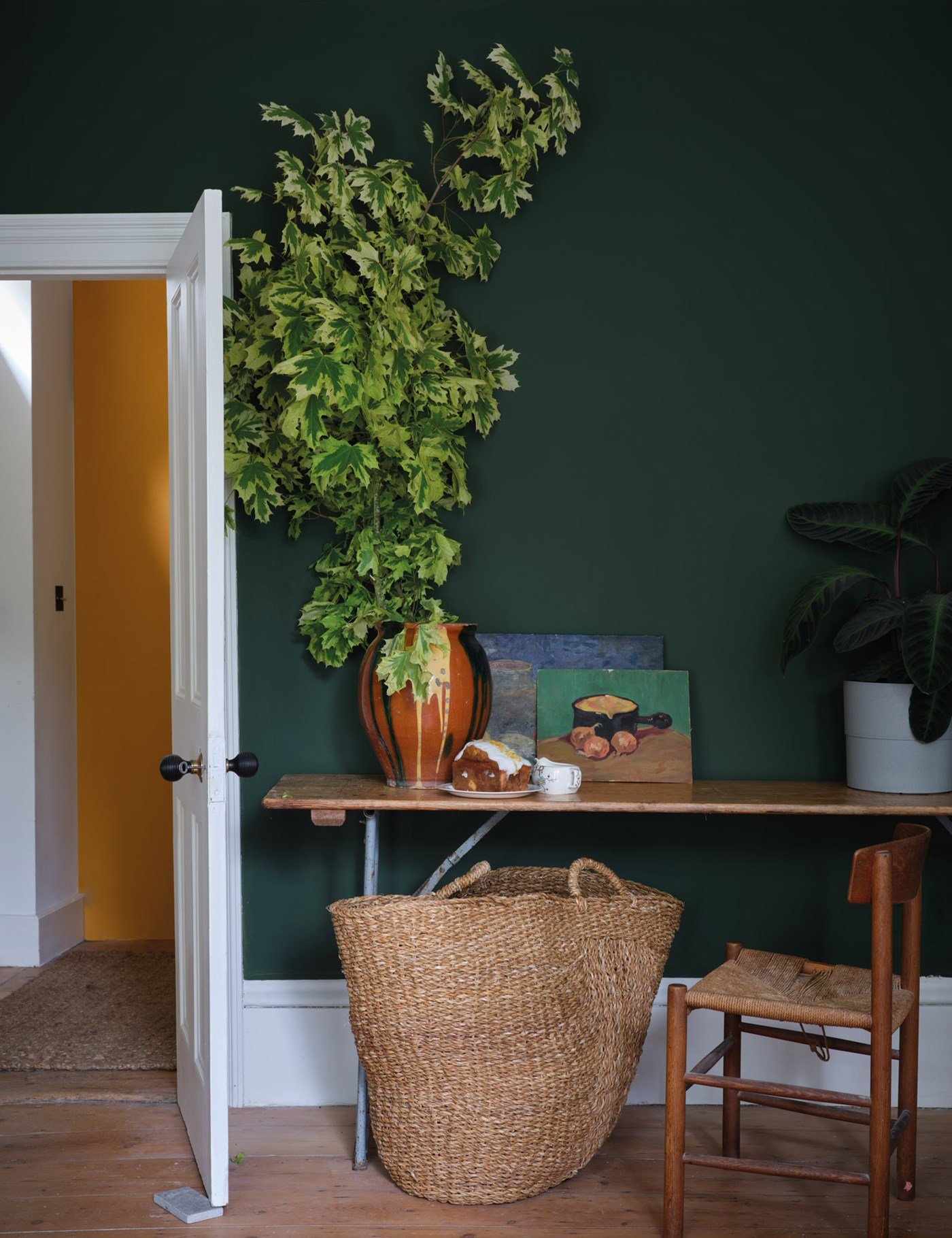 Dark green room with white woodwork