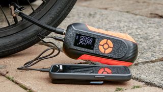 Lisen Portable Tire Inflator used to inflate bike tire and charge phone.