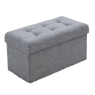 A rectangular gray storage ottoman