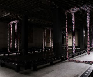 sculptures above the catwalk, bearing the American flag