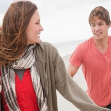 man and woman playing football