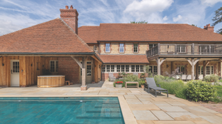Exterior of the house with a poll in the left bottom corner of the photo