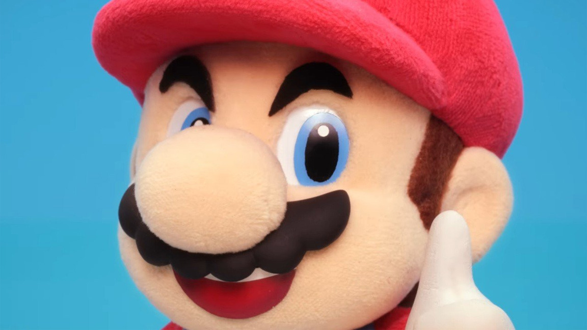 Mario stop motion animation; a felt Mario, in a red cap and moustache