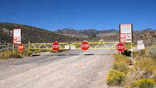 Stop signs and warning signs at entrance to Area 51.