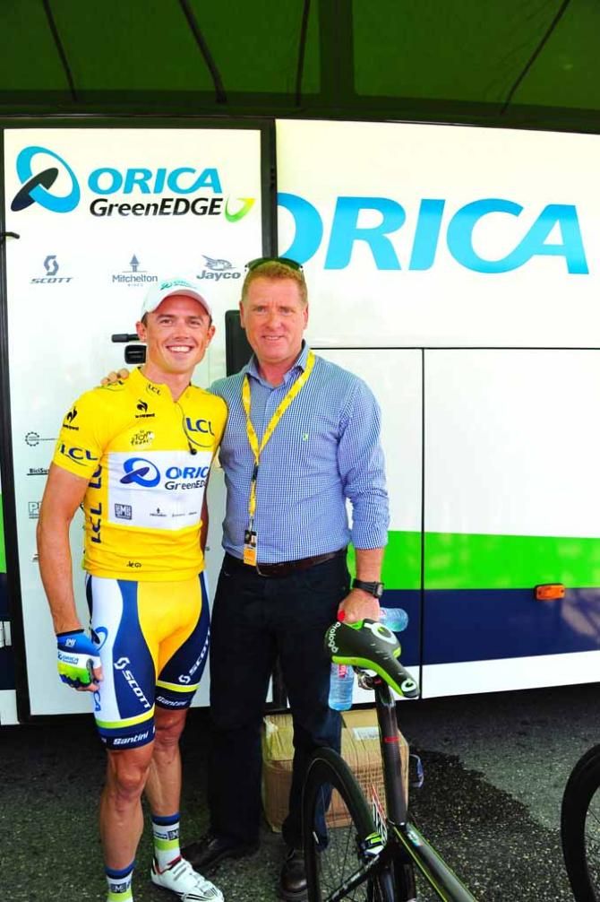 Simon Gerrans in yellow with Orica-GreenEdge manager Shayne Bannon.