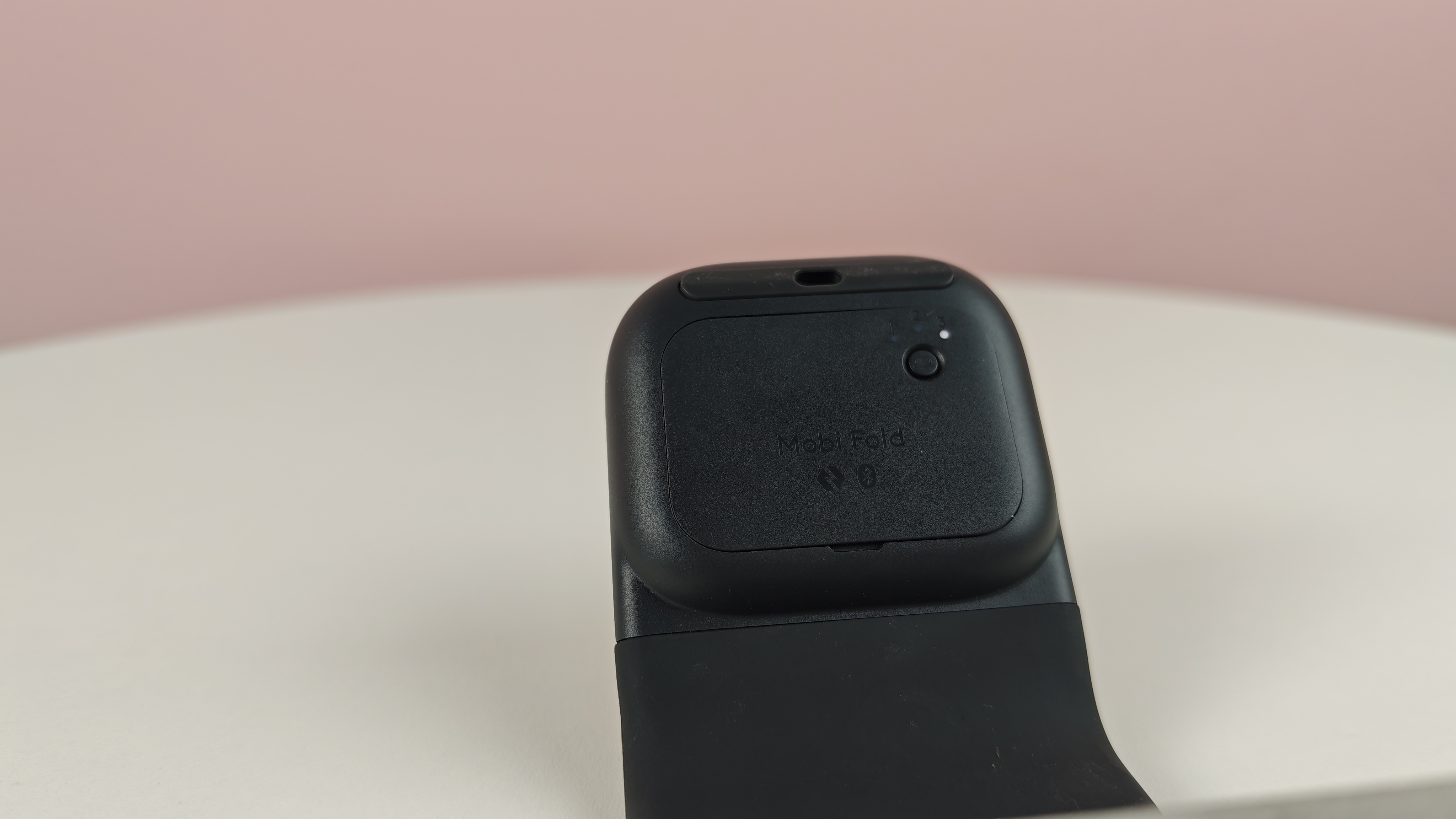 Pairing button on the Logitech Mobi Fold
