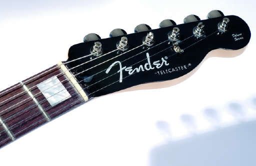 The headstock boasts vintage-style machine heads.