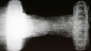 An X-ray image of the viking sword reveals an ornate hilt with a honeycomb-like design.