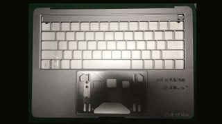 A leaked MacBook Pro shell showing OLED function keys
