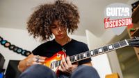 A seated teenager plays a Les Paul