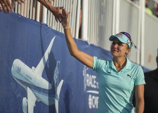 A tearful Lexi Thompson high-fives fans after missing out on the 2017 ANA Inspiration title