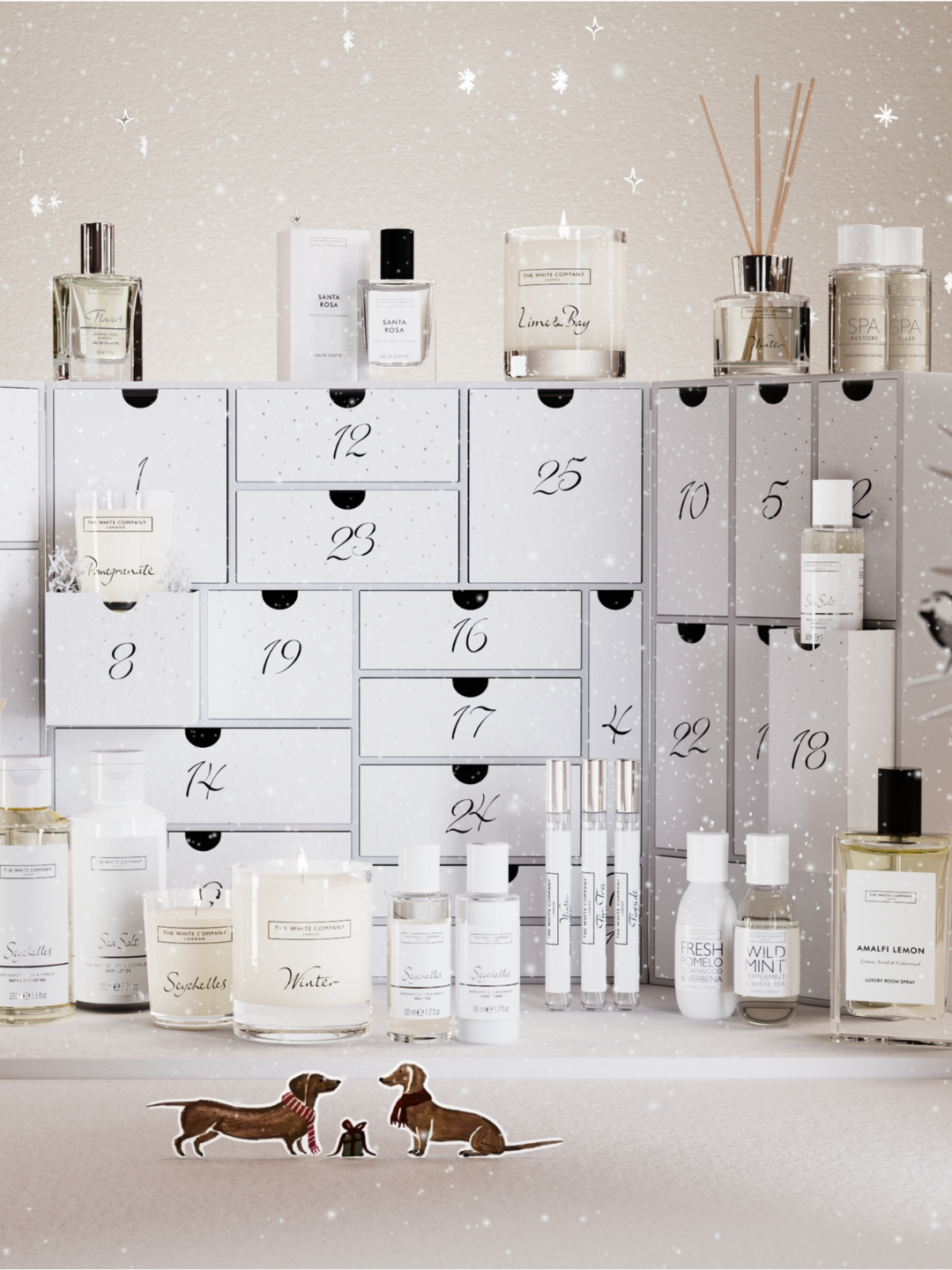 A white advent calendar from The White Company with candles, room sprays, reed diffusers, body care, and more