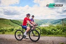 Riders stop to take in the view above a reservoir in the mountains of South Wales