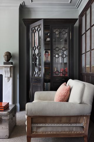 Love seat in a dark living room with alcove