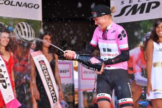 Ellen van Dijk celebrates on the podium after the opening team time trial at the Giro Rosa