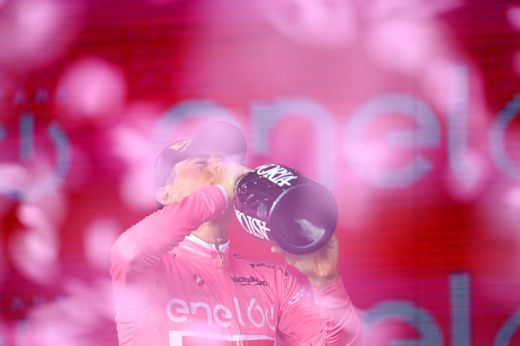 BLOCKHAUS ITALY MAY 15 Juan Pedro Lpez of Spain and Team Trek Segafredo celebrates winning the pink leader jersey and drinks Astoria champagne on the podium ceremony after the 105th Giro dItalia 2022 Stage 9 a 191km stage from Isernia to Blockhaus 1664m Giro WorldTour on May 15 2022 in Blockhaus Italy Photo by Tim de WaeleGetty Images