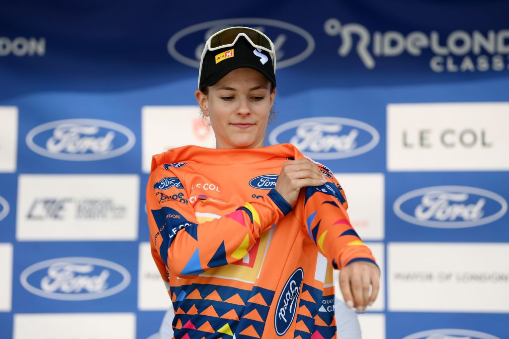 COLCHESTER ENGLAND MAY 24 Rebecca Koerner of Denmark and Team UnoX Mobility celebrates at podium as Orange Queen of the Mountain winner during the 10th Ford RideLondon Classique 2024 Stage 1 a 1592km stage from Saffron Walden to Colchester UCIWWT on May 24 2024 in Colchester England Photo by Alex BroadwayGetty Images