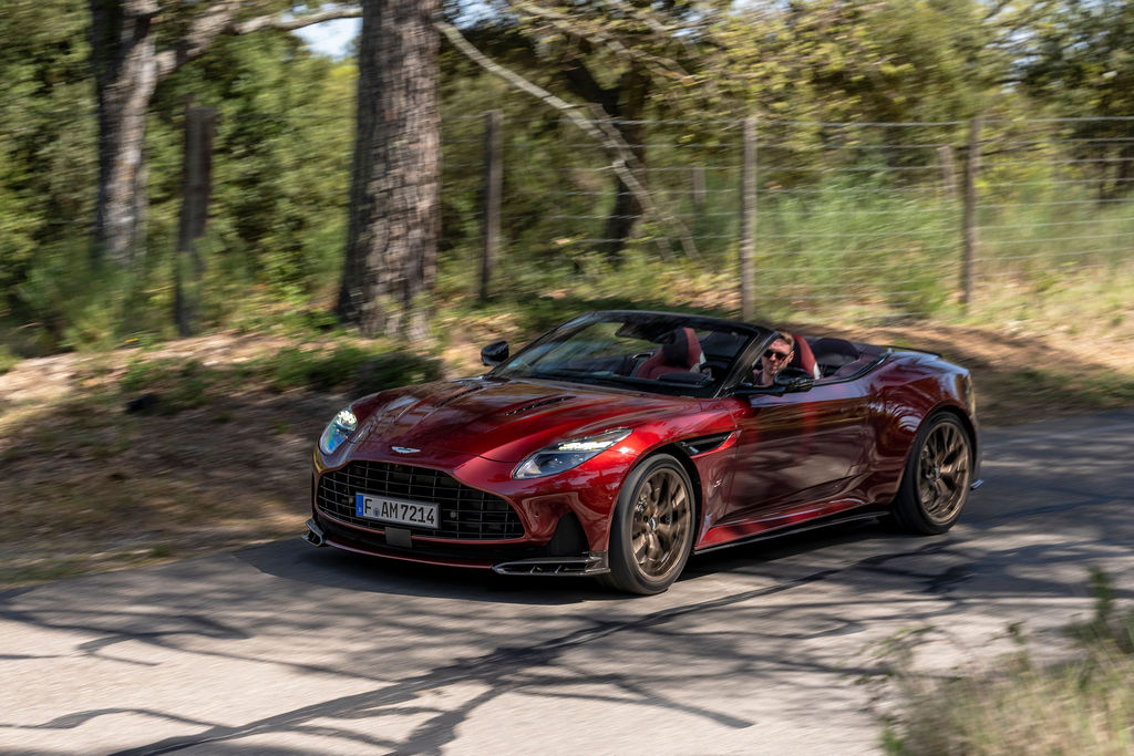 The author in a satin red DB12 S Volante