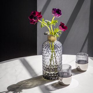 diamond cut glass vase with table and flower