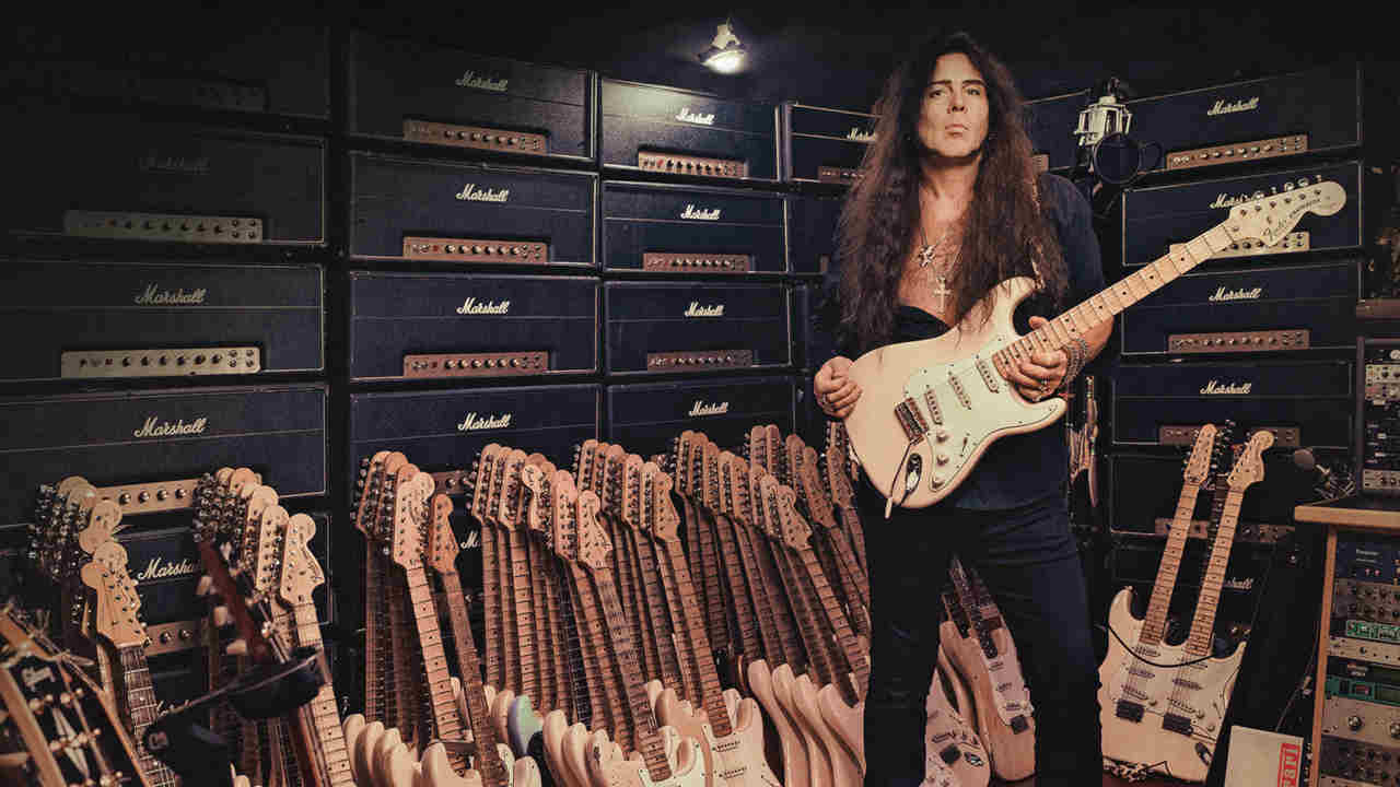 Yngwie Malmsteen posing for a photograph