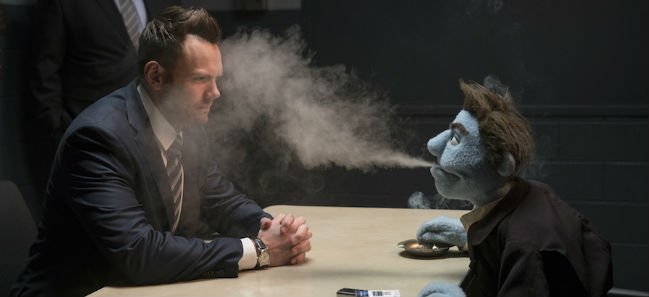 The Happytime Murders Joel McHale Puppet Blowing Smoke