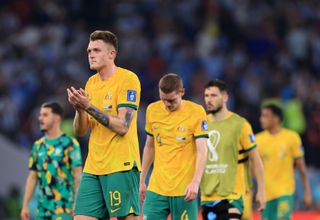 Australia's players applaud their fans after their World Cup last-16 defeat to Argentina.
