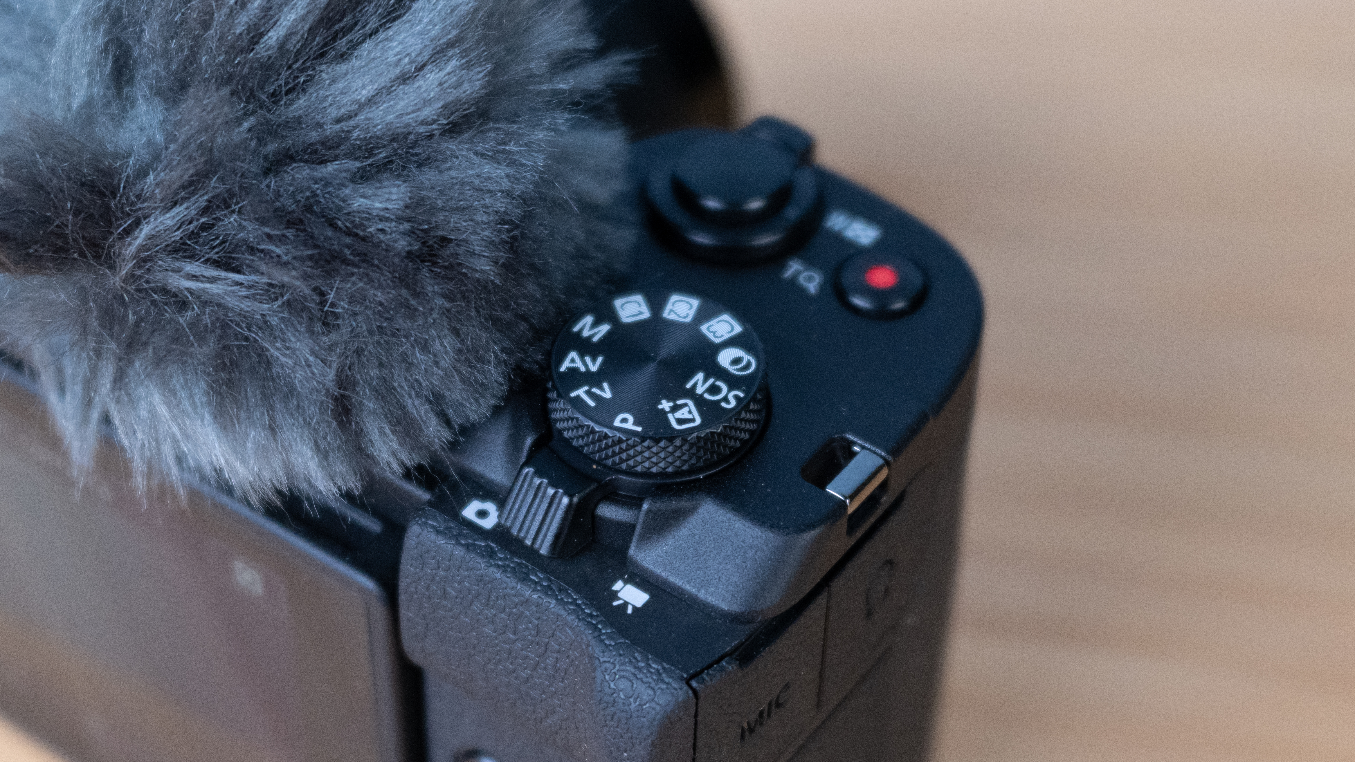 A black Canon PowerShot V1 compact vlogging camera