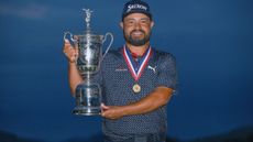 JJ Spaun holds the US Open trophy with the Jack Nicklaus medal around his neck