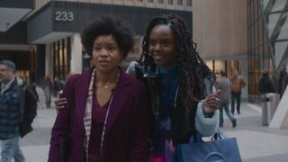 Sinclair Daniel and Ashleigh Murray as Nella and Hazel walking down a city street in The Other Black Girl