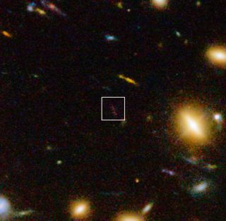 A look at the distant galaxy A1689-zD1. This image includes infrared light images from the WFC3 instrument on the NASA/ESA Hubble Space Telescope, as well as visible light views, and includes a close-up look at part of the galaxy cluster Abel 1689.